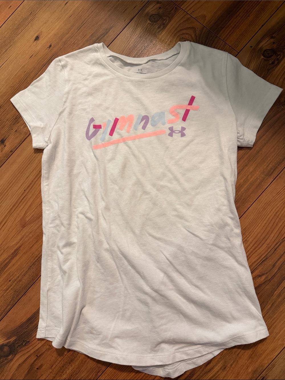 Under Armour White Girls' 'Gymnast' Logo Tee with Pink & Purple Accents